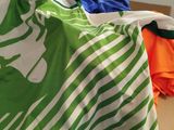 a green and white shopping bag sitting on a table