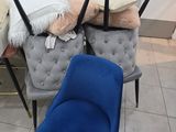 several chairs and a chair on display in a store