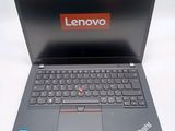 a laptop with a lenovo logo on the screen