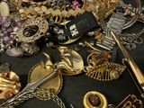 many different types of jewelry on the table