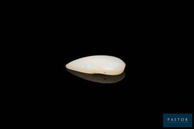 an image of a piece of white jade on a black surface