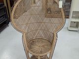 a wicker chair that is on display in a store