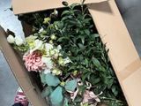 a box with a bunch of flowers inside of it