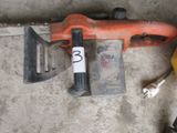 a chainsaw, a hammer, and a banana laying on the floor