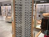 many glasses on display in the store for people to see