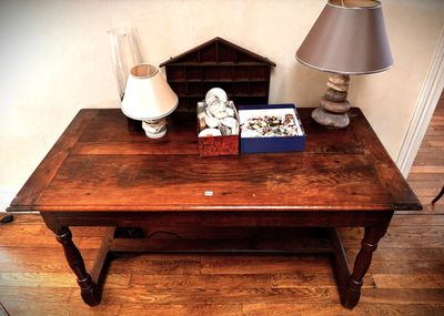 a small table with a lamp and a book on it