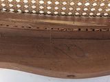 a close up of a wooden bench with writing on it