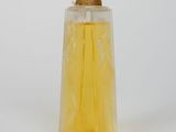 perfume bottle with yellow liquid on white background