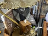 a cardboard box filled with assorted items and a clock