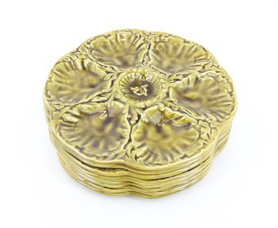 an image of a gold plate with a flower design on it