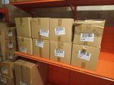boxes are stacked on a shelf in a store with labels on them
