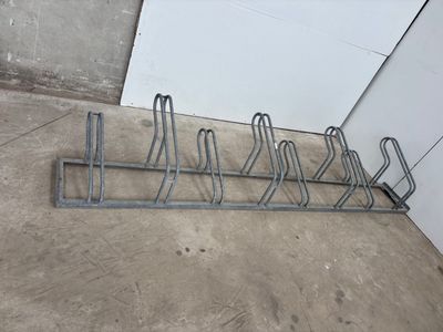 an image of a rack with a bunch of bikes on it