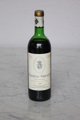 a bottle of wine that is sitting on a table