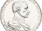 an image of a silver coin with a portrait of a man on it