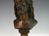 bronze bust of jesus with a crown of thorns on his head