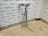 an image of a microphone on a tripod in front of a wall