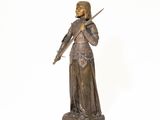 bronze statue of a woman holding a sword on a white background