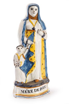 a statue of a woman holding a baby and a dog