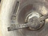 a close up of a metal pan with a spoon in it