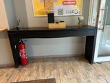 a table with a fire extinguisher and a fire extinguisher next to it