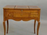 an image of a small wooden table with drawers
