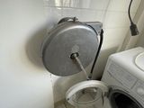 a washer and a dryer in a small bathroom
