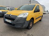 yellow citrole van parked in a parking lot next to other cars
