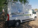a van that is parked on the side of the road