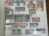 a book with stamps on it sitting on a table