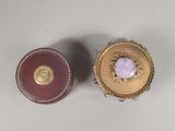 pair of gold and amethoral brooches with amethoral in center