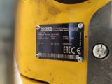 a close up of a parking meter with a sticker on it