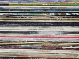 a lot of records stacked on top of each other