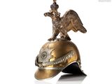 a gold helmet with an eagle on top of it