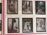 many pictures of people on the wall of a building