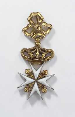 a close up of a medal on a white surface