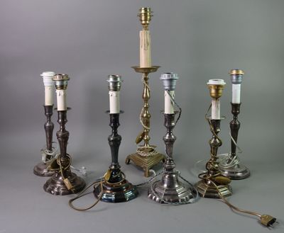five different types of candles that are on the table