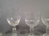 three empty wine glasses sitting next to each other on a table
