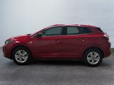 the red toyota rav is parked in a parking lot