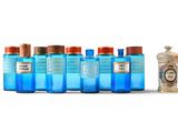 six bottles of blue liquid and a small bottle of water