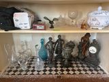 a shelf that has many different glass items on it