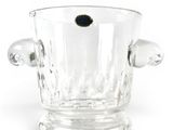 a glass ice bucket with a black dot in it