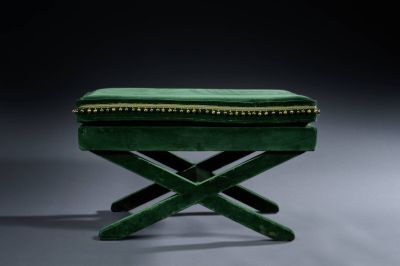 an image of a green bench with a green cushion on top of it