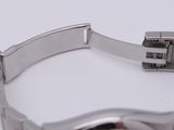 a close up of a wrist watch on a white surface