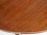 a wooden table with a white base and a brown table top