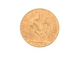 a gold coin with a picture of a rooster on it