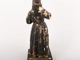 a black and white statue of a woman in a robe