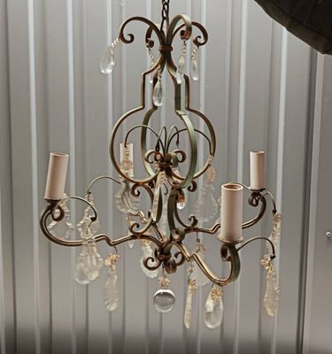 a chandelier hanging from the ceiling in a room