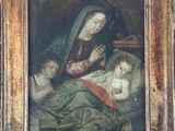an old painting of a woman holding a baby in a wooden frame