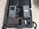 a case with two cell phones in it on the ground