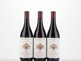 three bottles of wine sitting on top of a table